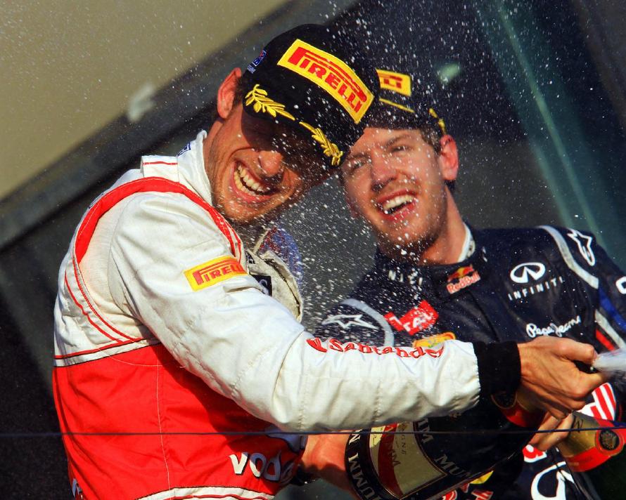 Race winner Jenson Button (GBR) McLaren, with second placed Sebastian Vettel (GER) Red Bull Racing, on the podium. Formula One World Championship, Rd1, Australian Grand Prix, Race, Albert Park, Melbourne, Australia, Sunday, 18 March 2012. © Sutton Images. No reproduction without permission. Race winner Jenson Button (GBR) McLaren, with second placed Sebastian Vettel (GER) Red Bull Racing, on the podium. Formula One World Championship, Rd1, Australian Grand Prix, Race, Albert Park, Melbourne, Australia, Sunday, 18 March 2012. © Sutton Images. No reproduction without permission.