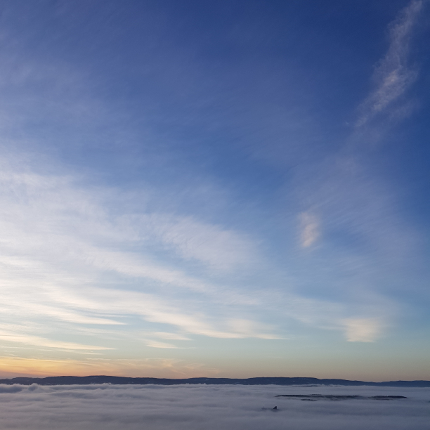 Fog on the Oslo fjord. In the distance, the top of a RORO ferry chimney.