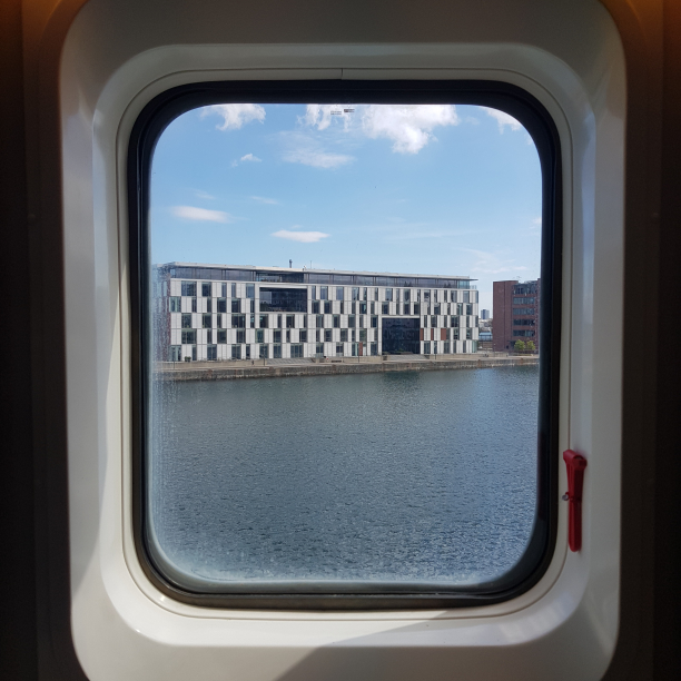 Bye, bye, Denmark. The Copenhagen, Denmark harbour through a cabin window.