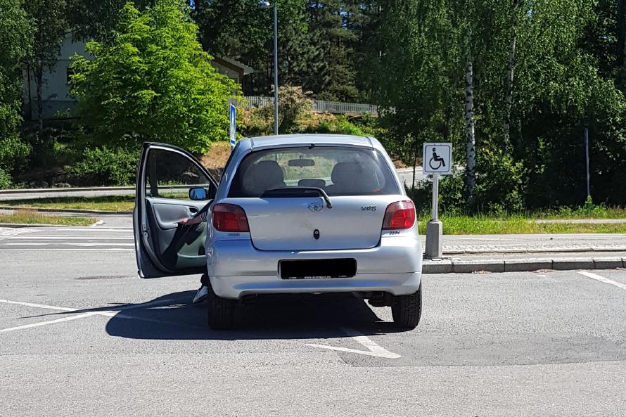 Half the car is on a handicap spot he's not allowed to park on, while the other half is parked in a no parking zone. The emergency? Had to drop off a package at the post office. Being an idiot is not a handicap. Half the car is on a handicap spot he’s not allowed to park on, while the other half is parked in a no parking zone.
