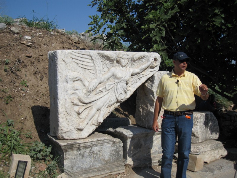 Our guide in front of the goddess Nike. Can you spot the Nike brand logo?