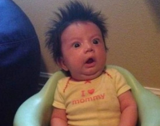 A toddler showing the most surprised face you can imagine.