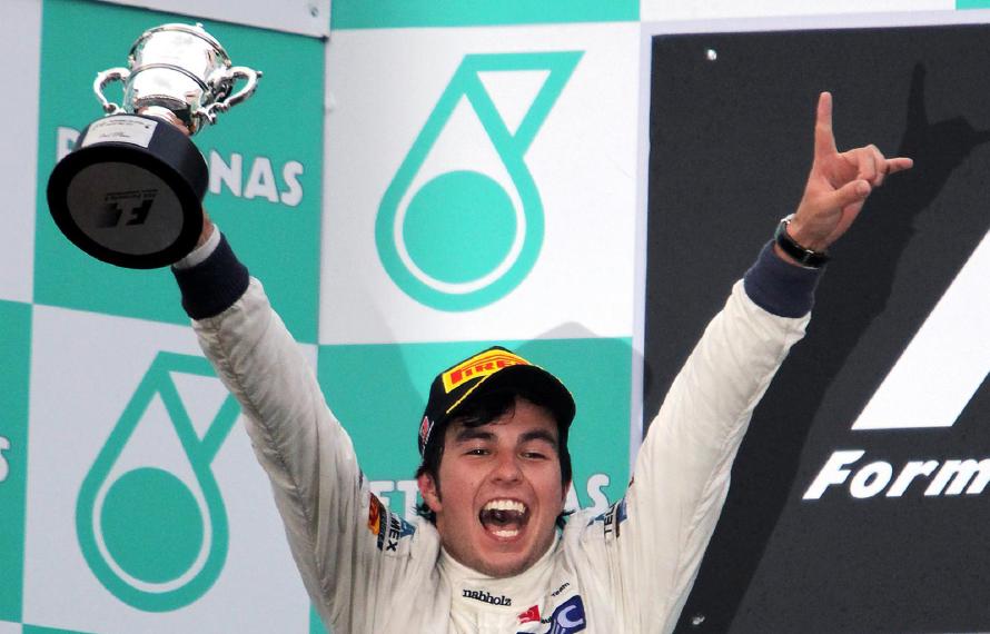 Second placed Sergio Perez (MEX) Sauber celebrates on the podium. Formula One World Championship, Rd2, Malaysian Grand Prix, Race, Sepang, Malaysia, Sunday, 25 March 2012. © Sutton Images. No reproduction without permission. Second placed Sergio Perez (MEX) Sauber celebrates on the podium. Formula One World Championship, Rd2, Malaysian Grand Prix, Race, Sepang, Malaysia, Sunday, 25 March 2012. © Sutton Images. No reproduction without permission.