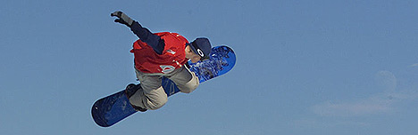 Snowboarder doing a grab