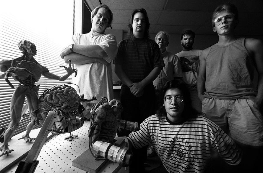 This pic was taken for an interview in 1994 while making DOOM II. Jay, Adrian, Bobby, Kevin, John, me in front. (https://twitter.com/romero/status/543011838024105985) John Romero describes this picture: "This pic was taken for an interview in 1994 while making DOOM II. Jay, Adrian, Bobby, Kevin, John, me in front."