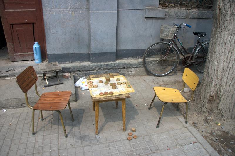 Some board game, probably Xiangqi. The board belonged to two guys working at a bike repair shop nearby.