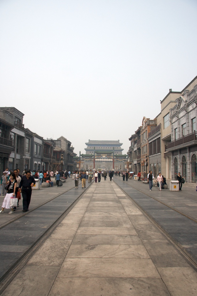 The same street, this time without Chinese men pointing. In the background one of the entries to Tiananmen Square. Before the 2008 Beijing Olympics, the Chinese buldozed entire blocks of houses and built new ones. This is one of the streets that had to go. A good plan in theory, the only problem is that the rental price is so high none of the original shop keepers can afford to move their shops back to the area, so almost every single house is now empty.