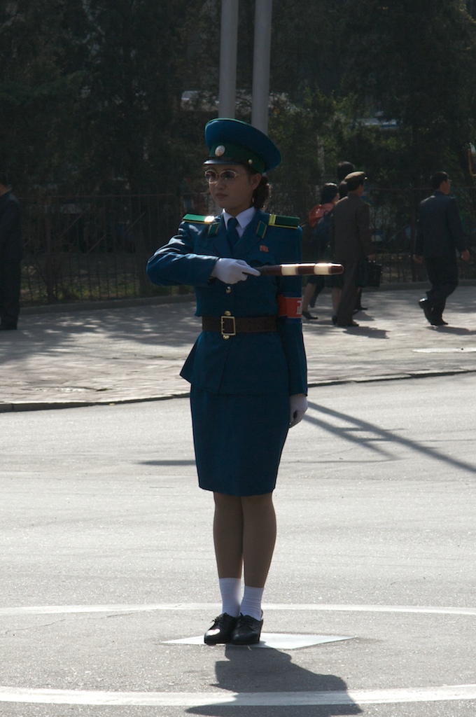 Traffic Lady. Even though Pyongyang might not have that many cars, they have traffic lights. But since electricity is somewhat hard to come by, they have turned them off and placed a ’traffic lady’ (they were actually called that by our guides) in every intersection.