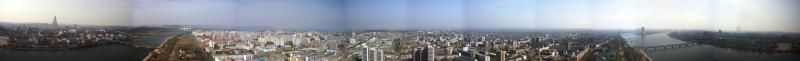 A 360 degree panorama taken from the Juche Tower. To get a better view, you should save the image to your computer and zoom in a little. The bridge to the left is not destroyed by the way, it just turned out that way because I didn&rsquo;t take enough pictures.
