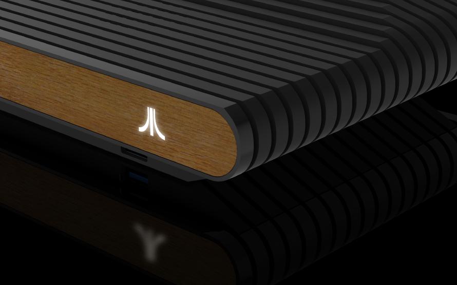 Atari VCS detail. A computer generated image of the front of the Atari VCS with a white, glowing Atari logo.