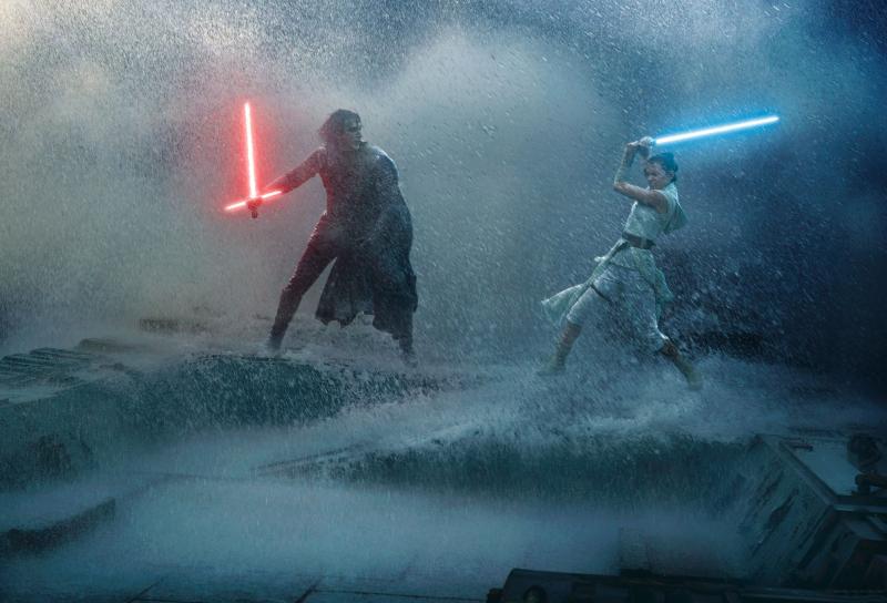 Kylo Ren and Rey in a light saber fight on top of the downed Death Star.