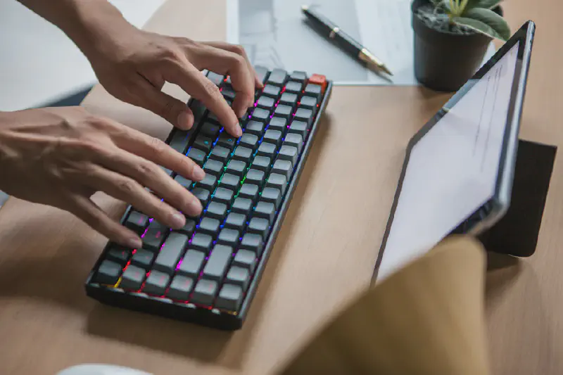 Someone typing on a Keychron K2